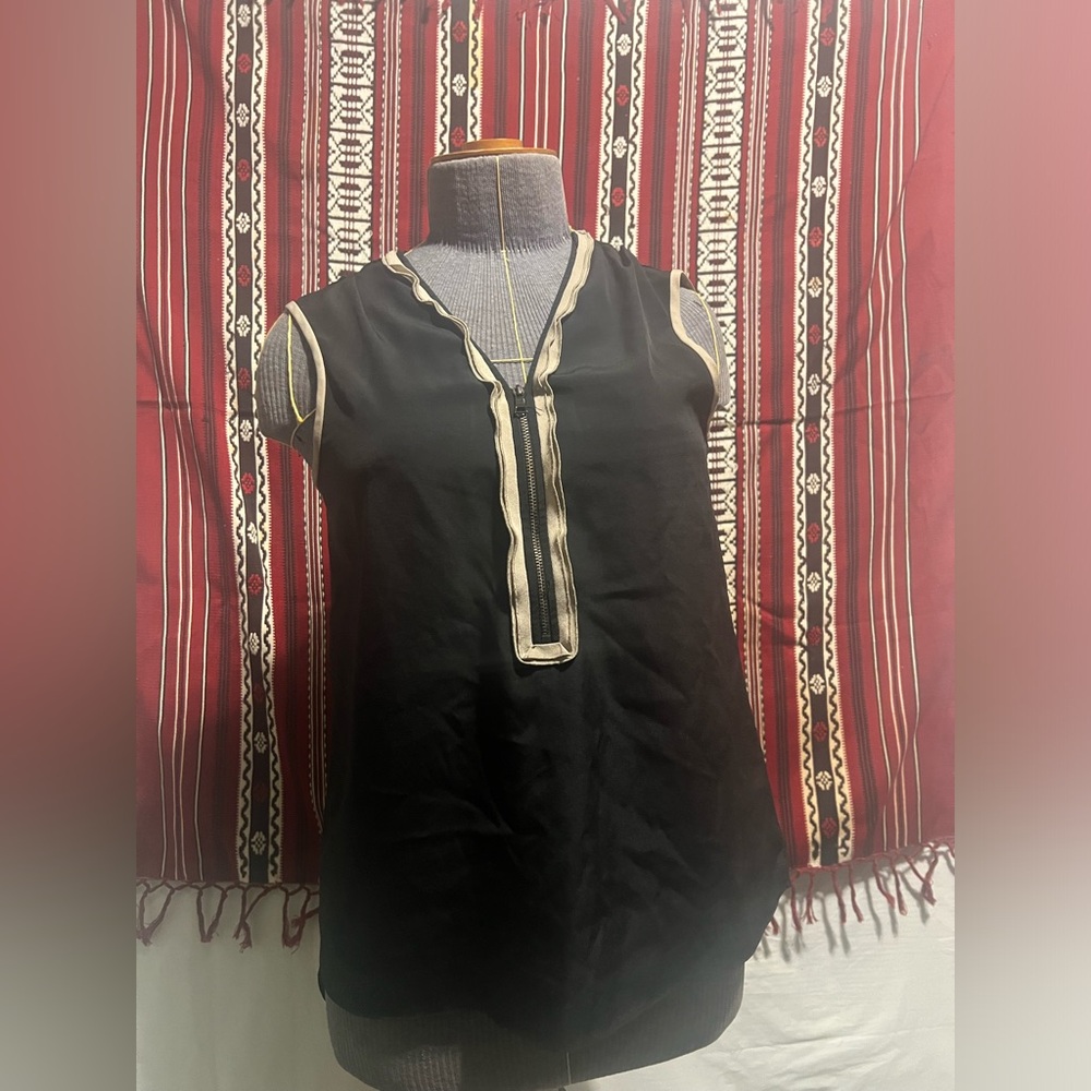Small Black camisole with tan trim at the collar